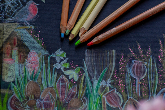 a group of pencils sitting on top of a table