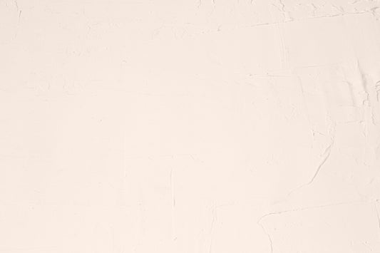 A white sheet with a black cat sitting on top of it