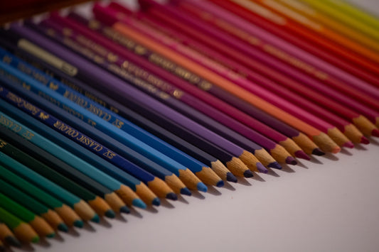 A colorful assortment of sharpened colored pencils arranged diagonally.