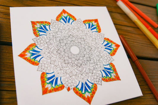 Mandala coloring page with orange and blue details.